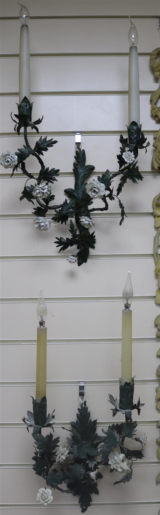 A set of 4 painted metal and porcelain wall lights